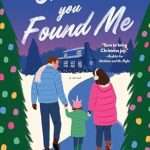 Illustrated cover showing three white people in winter clothes, a man in a blue jacket and pale scarf holding the hand of little girl in a pink unicorn beanie and a green jacket who is in turn holding the hand of a woman wearing a pink jacket and earmuffs. They are walking between two Christmas trees down a path cleared of snow, toward a two story wooden cabin/house.