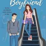 Illustrated cover with a blue background showing a pretty white girl with long brown hair coming down an escalator. She's wearing a pink tee and blue jeans and has a purple jacket tied around her wait and is holding a purple book. At the foot of the escalator is a hot young white guy wearing jeans and a grey henley. They are both facing front and he has his hands in his front pockets.